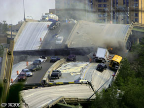 Vehicles are scattered along the broken remains of the Minneapolis Minnesota Interstate 35W bridge.