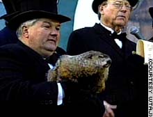 The handsome Punxsutawney Phil sees his shadow. (Phil is the one without the hat.)