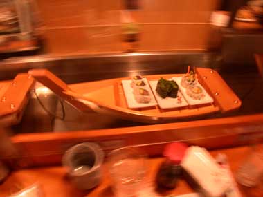 A sushi boat in action