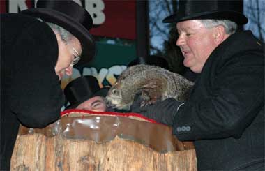 Punxsutawney Phil reads his proclamation.