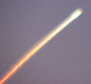 The firey trail of the Space Shuttle Discovery as seen from Jensen Beach Florida